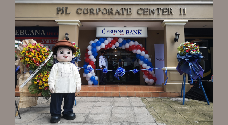 Ninong Ceb, Cebuana Lhuillier's mascot, before the official ribbon cutting and opening of Cebuana Lhuillier Bank in Cebu City | CebuFinest